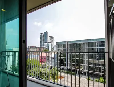 Spacious balcony with stunning city view in modern apartment building