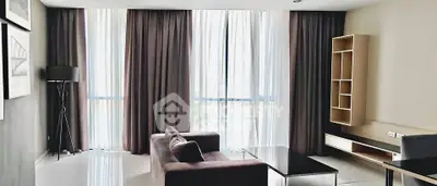 Modern living room with floor-to-ceiling windows and elegant furnishings