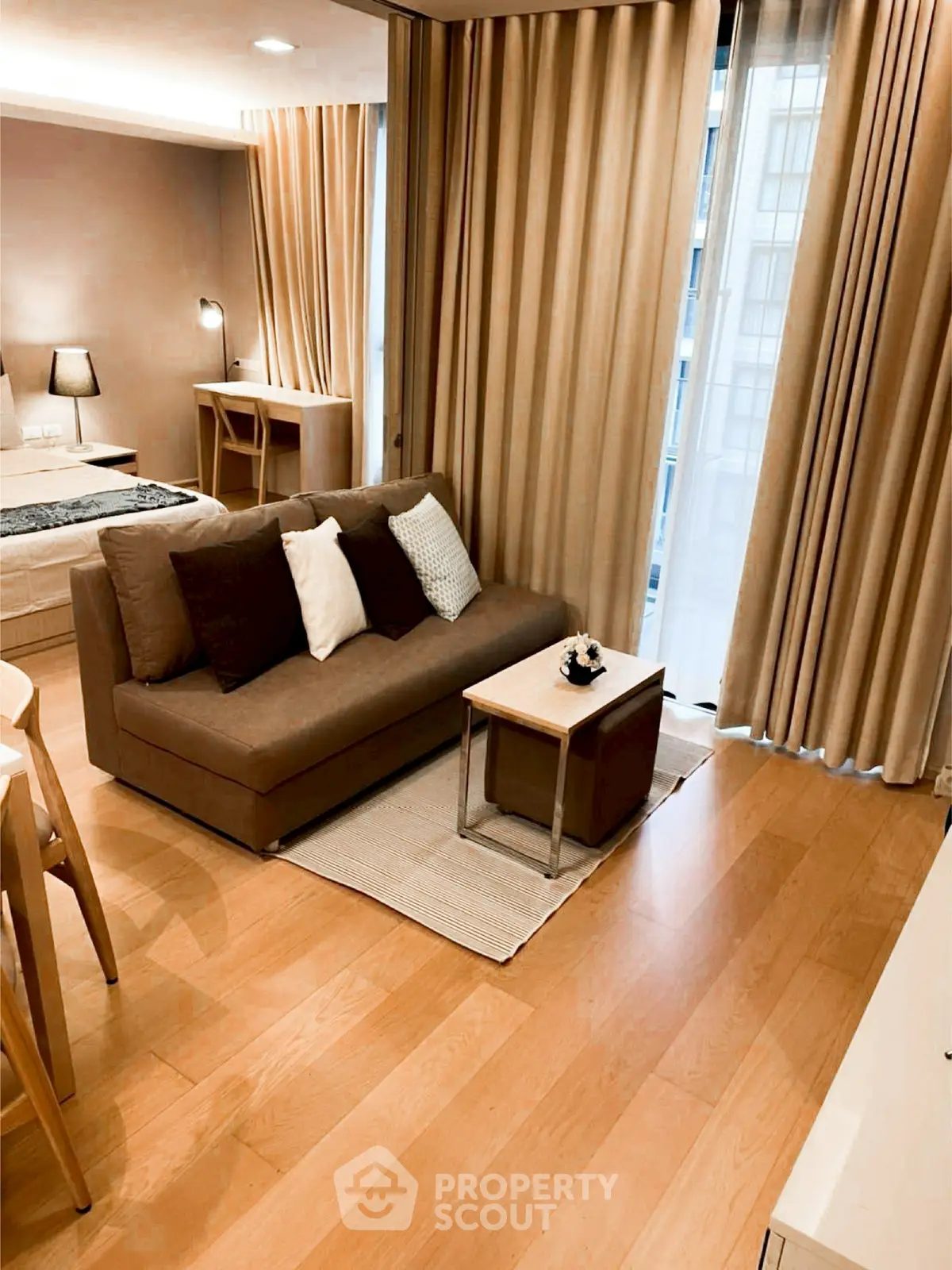 Modern studio apartment with cozy living area and elegant decor