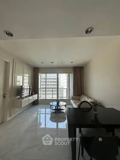 Spacious modern living room with city view and elegant furnishings