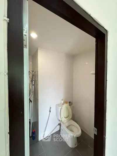 Modern bathroom with sleek design and essential fixtures.