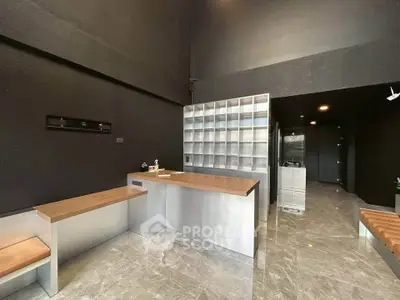 Modern commercial space with sleek metal and wood finishes, ideal for retail or office use.