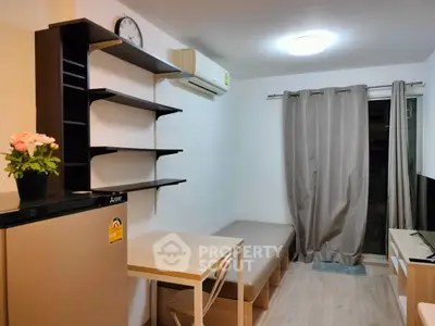 Cozy living room with modern furniture and air conditioning in a compact apartment.