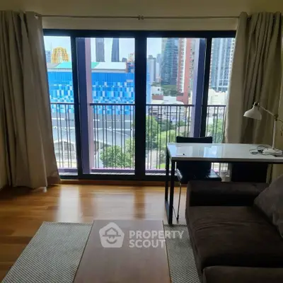 Modern living room with city view, featuring sleek furniture and large windows.