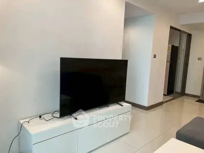 Modern living room with sleek TV setup and minimalist decor