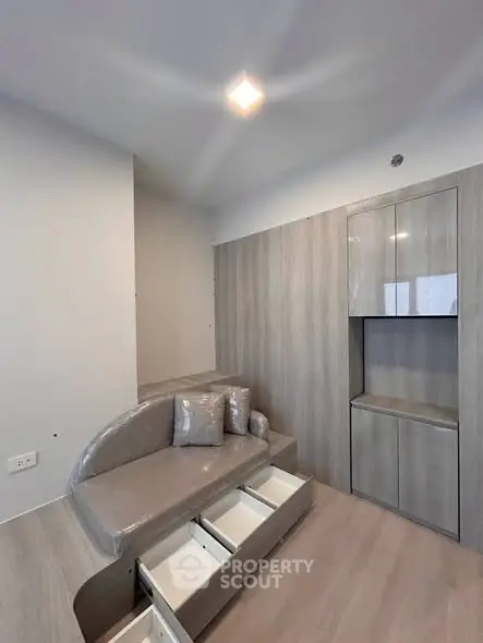 Modern compact living room with built-in storage and sleek design