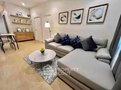 Stylish living room with modern decor and cozy sectional sofa in a contemporary apartment.