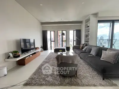 Spacious modern living room with panoramic city views and elegant decor