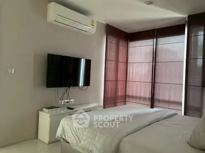 Modern bedroom with air conditioning and wall-mounted TV, featuring stylish blinds and a cozy bed.