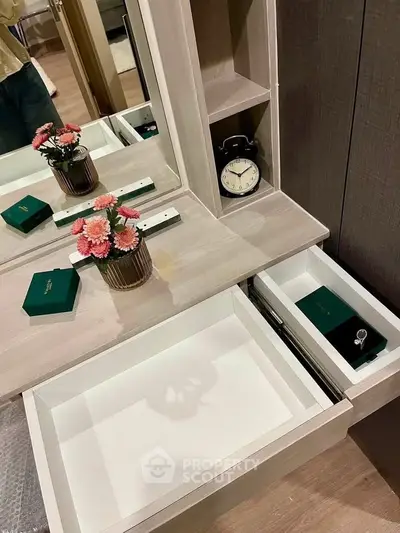 Elegant bedroom vanity with mirror, drawers, and decorative clock, perfect for modern interiors.