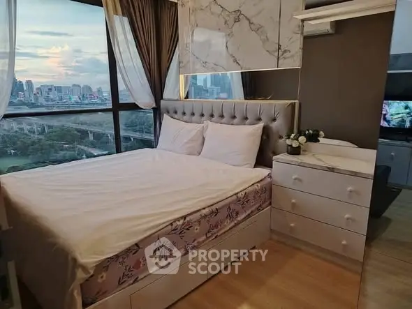 Luxurious bedroom with stunning city view and elegant decor