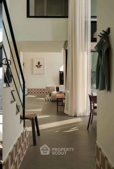 Spacious modern living room with high ceilings and elegant decor