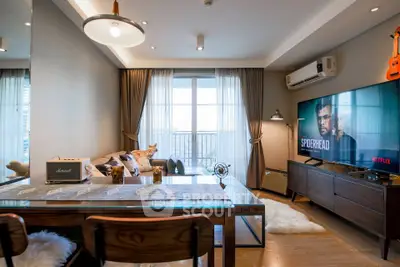 Stylish modern living room with large window and elegant decor