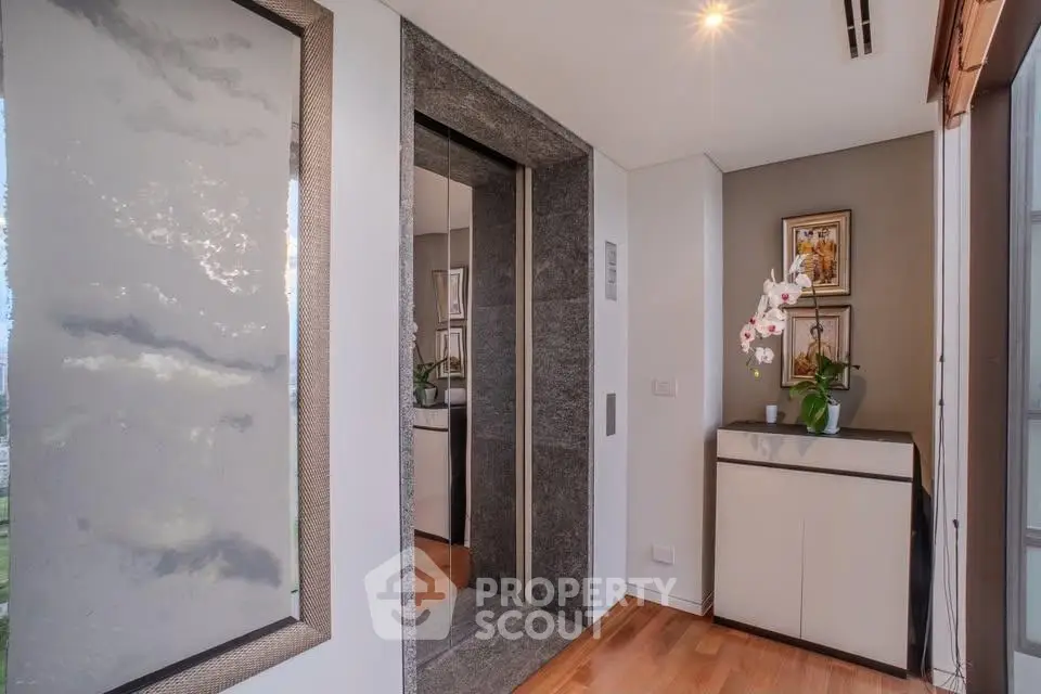 Elegant modern elevator lobby with stylish decor and wooden flooring