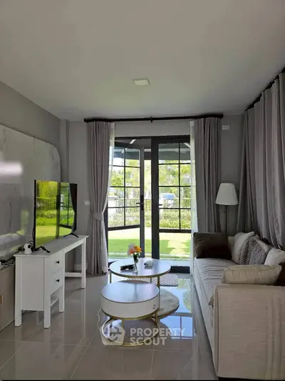 Modern living room with large windows and stylish decor