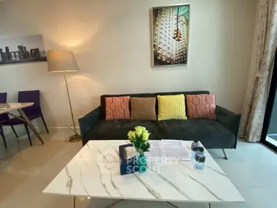 Modern living room with stylish decor and cozy seating area, perfect for relaxation and entertaining.