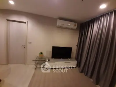 Modern living room with air conditioning and sleek TV setup