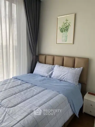 Cozy bedroom with soft lighting and elegant decor, perfect for relaxation.