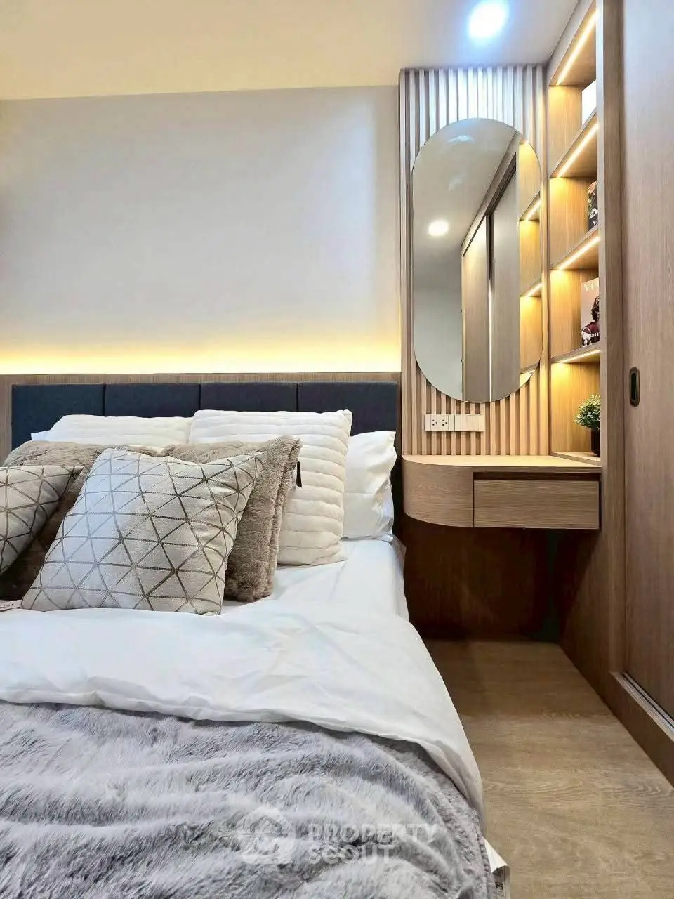 Luxurious bedroom with modern design, cozy bedding, and elegant lighting for ultimate comfort.