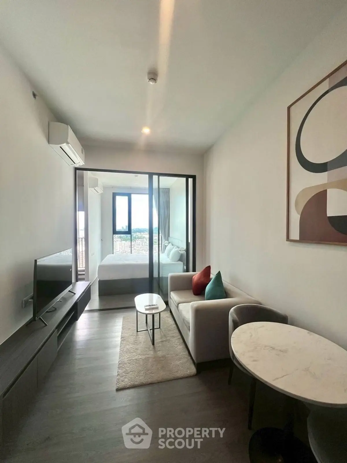 Modern living room with sleek design and balcony view