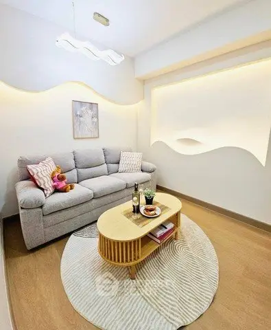 Stylish modern living room with cozy sofa and elegant lighting