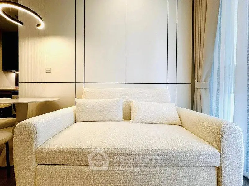 Luxurious modern living room with elegant white sofa and stylish lighting