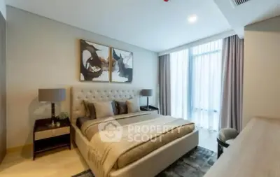 Luxurious bedroom with elegant decor and large window for natural light