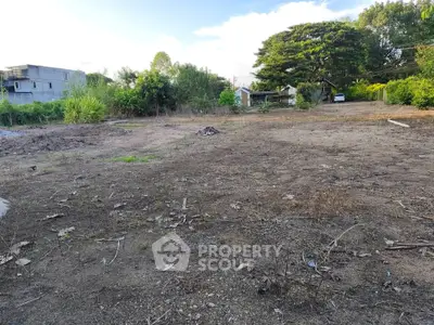 Spacious vacant land with lush greenery, ideal for development or investment opportunities.