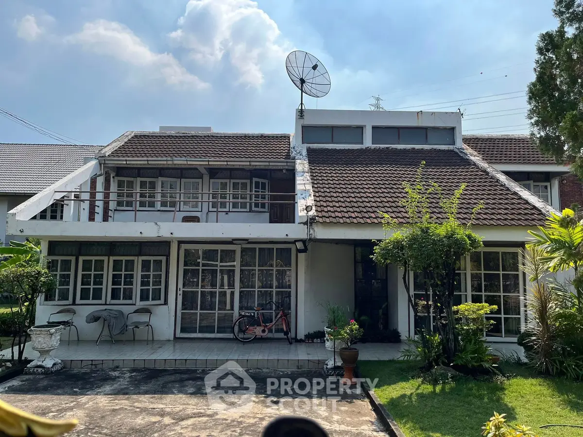 Charming suburban house with lush garden and spacious patio, perfect for family living.