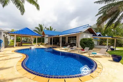 Luxurious villa with private pool and tropical garden, perfect for relaxation and entertaining.