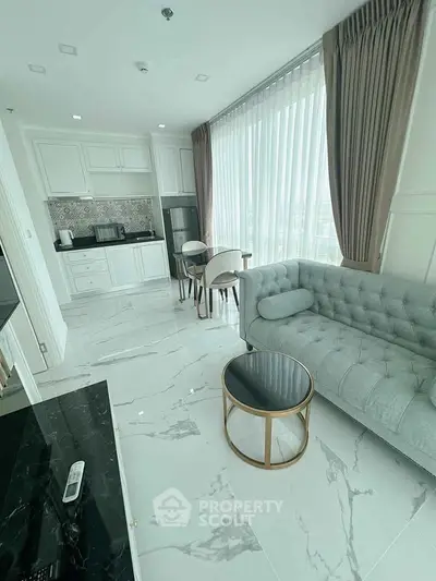 Elegant modern living room with marble flooring and open kitchen layout