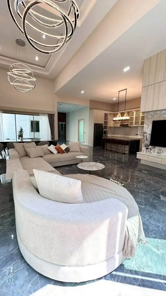 Luxurious modern living room with elegant lighting and spacious seating area