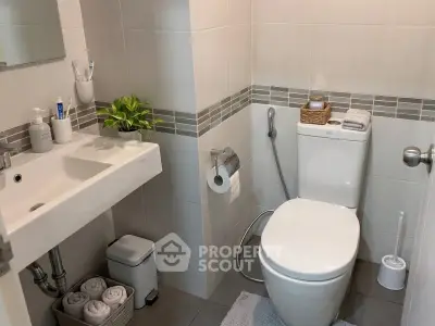 Modern bathroom with sleek fixtures and stylish tile accents