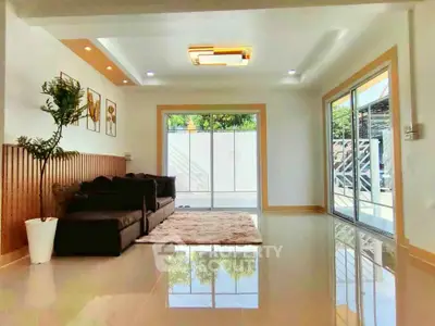 Spacious modern living room with large windows and stylish decor