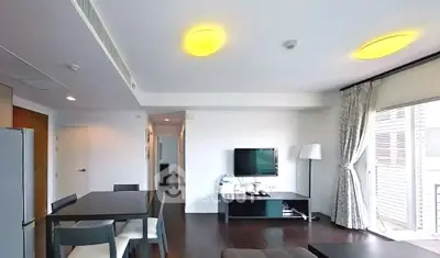Modern living room with sleek furniture and natural light, perfect for urban living.
