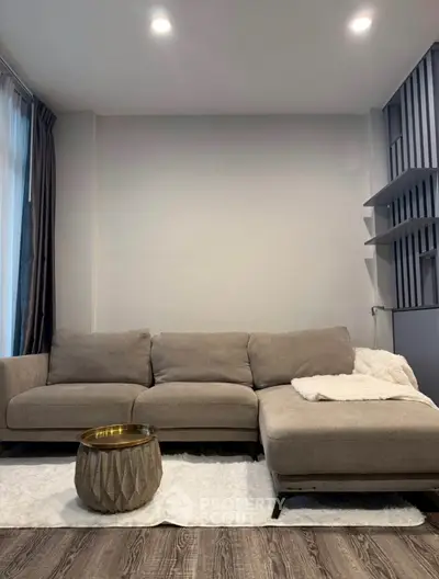 Modern living room with cozy sectional sofa and stylish decor