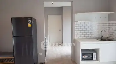 Modern kitchen with sleek appliances and white subway tile backsplash