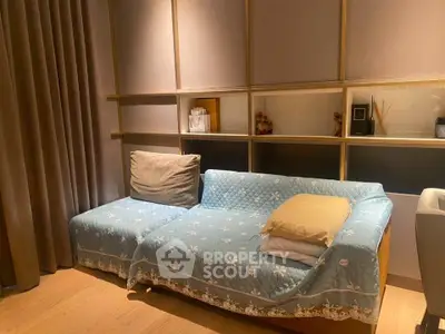 Cozy living room with stylish sofa and elegant shelving, perfect for modern home decor.