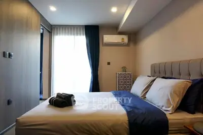 Modern bedroom with stylish decor and natural light