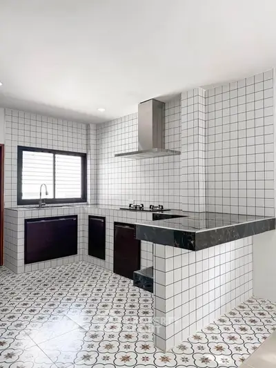 Modern kitchen with stylish tile design and sleek appliances