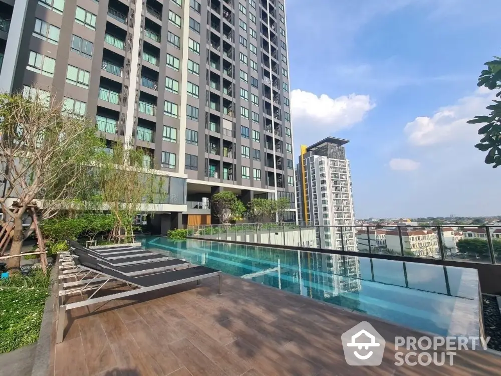 Luxurious high-rise building with stunning rooftop pool and city view