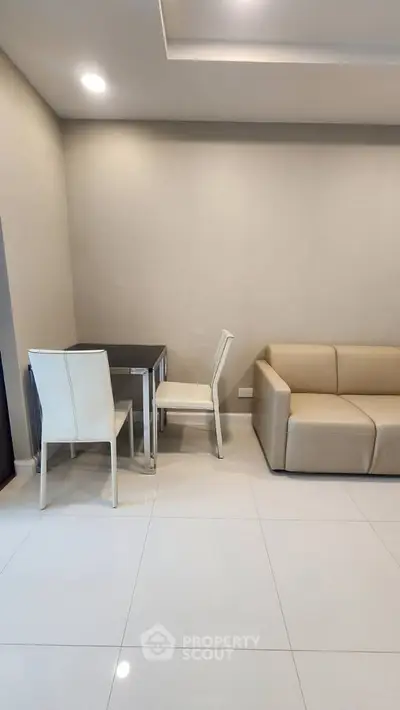 Modern living room with sleek furniture and minimalist design, perfect for urban living.