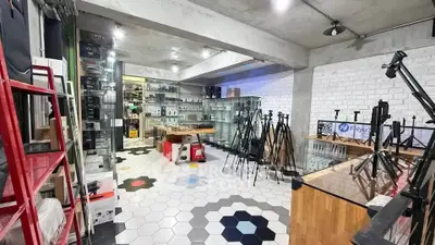 Spacious commercial space with modern design and ample display area, perfect for retail or showroom purposes.