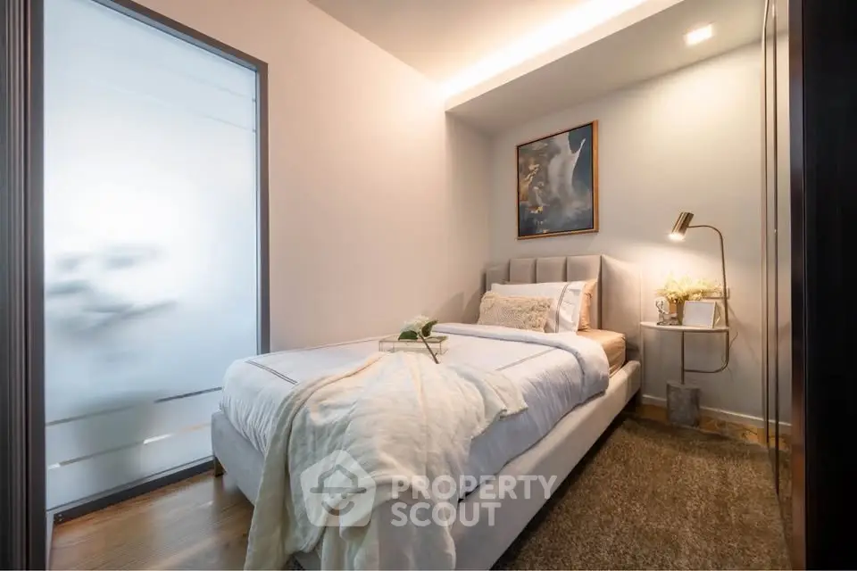 Cozy modern bedroom with elegant decor and soft lighting