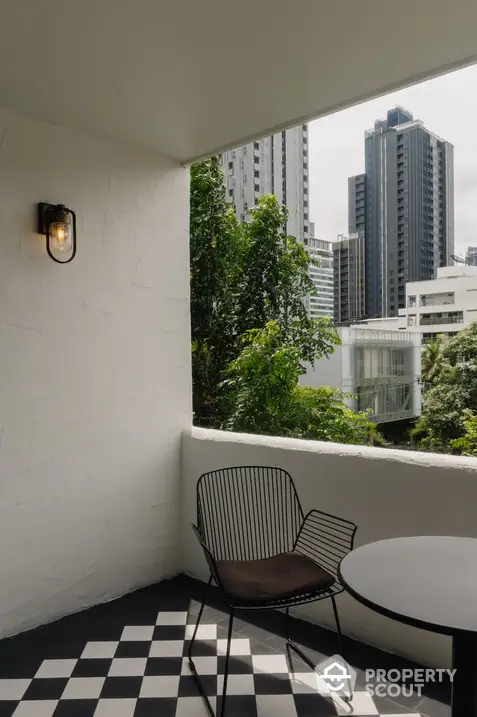 Chic urban balcony with modern furniture and cityscape view