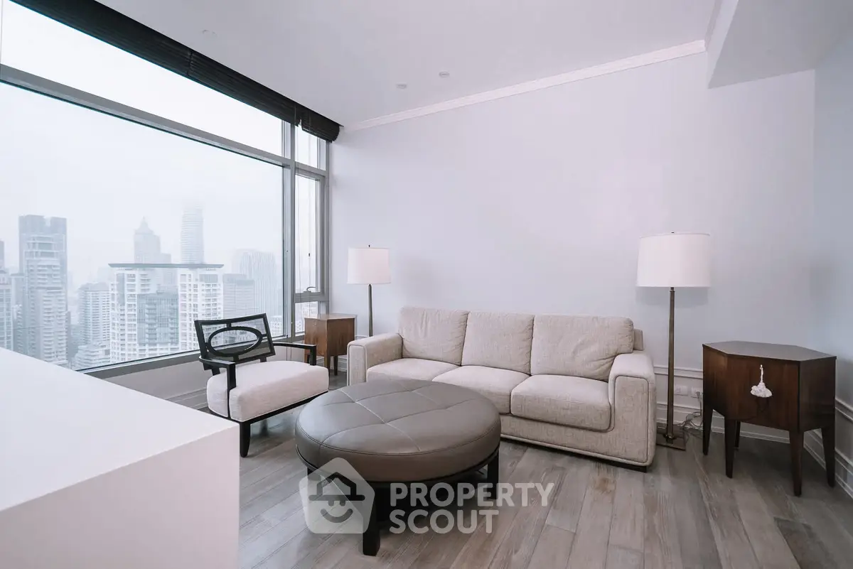 Modern living room with panoramic city view, featuring stylish furniture and elegant decor.