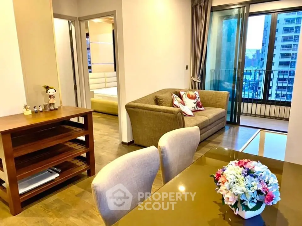 Stylish modern living room with balcony view in urban apartment