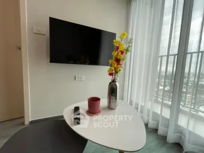 Modern living room with wall-mounted TV and stylish decor