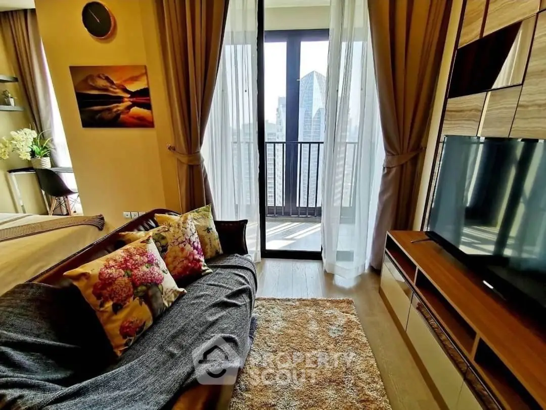 Stylish living room with balcony view in modern apartment