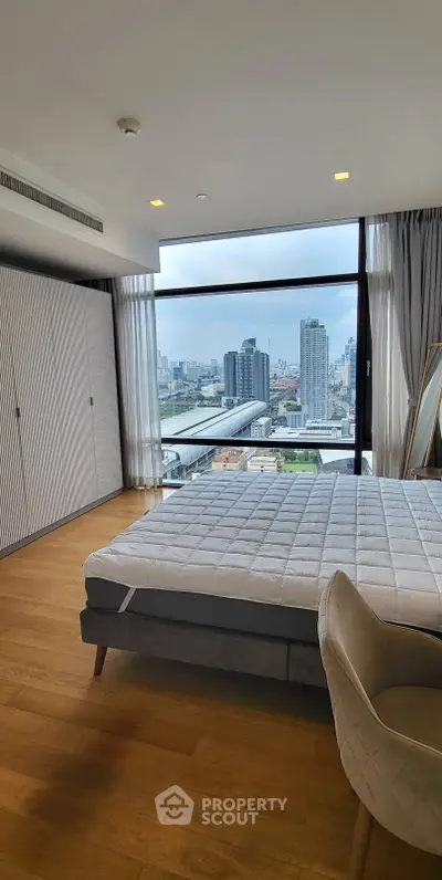 Luxurious bedroom with stunning city view and modern furnishings